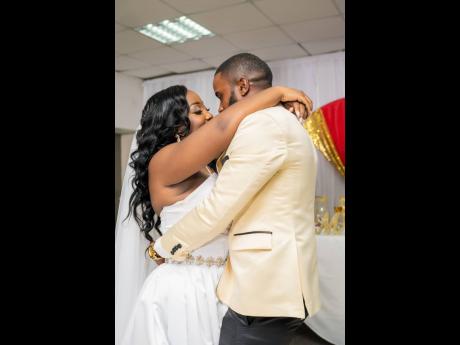 Lost in their own world amid the celebration, the newly-weds share an intimate moment, their eyes locked on each other.