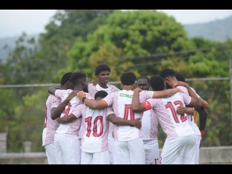 Credit: Courtesy of @phoenixchapeltonmaroonsfc Chapelton Maroons players huddle ahead of the start of their first Jamaica Premier League game against Tivoli Gardens at Turner Park on Sunday.