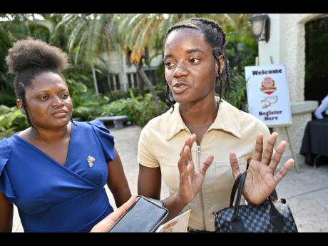Shantalee Wilson (right), Burger King scholarship bursary awardee heading to The University of the West Indies, speaks to the media while her mother, Samantha Hamilton McDermott, looks on, at the Burger King Jamaica National Scholarship Awards Programme ce