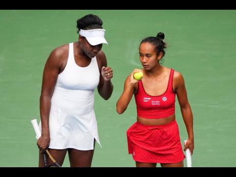 Credit: AP Venus Williams (left) of the United States and Leylah Fernandez, of Canada, talk on the court during a first round women’s doubles match against Lyudmyla Kichenok, of the Czech Republic and Ellen Perez, of Australia at the US Open tennis championships ye