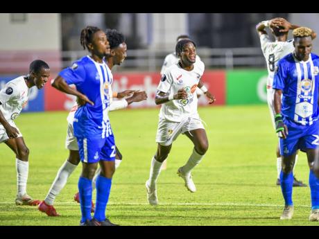 Credit: Matthew McKoy Shamar Watson (centre) of Cavalier FC celebrates his goal during last night’s Concacaf Caribbean Cup match between Cavalier and Juventus FC at Sabina Park. The game ended in a 1-1 draw.