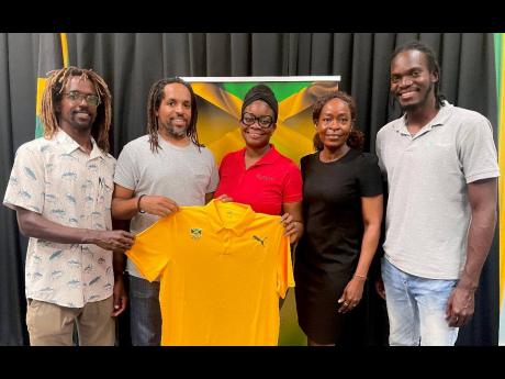 From left:  National surf coach Icah Wilmot, Jamaica Surfing Association President Inilek Wilmot, Brand Marketing executive of GWM, Latara Boodie Stevens, Jamaica Olympic Association Member Relations Manager Novelette Harris and National surfer Akeam Phill