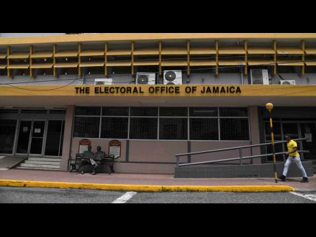 A man walks past the Electoral Office of Jamaica building on Duke Street in Kingston on July 17, 2025.