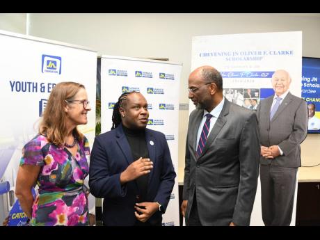 Odain Murray (centre) 2025 Chevening/JN Oliver F Clarke scholarship awardee, in conversation with Judith Slater, British high  commissioner to Jamaica, and JN Group Chief Executive Officer Earl Jarrett during a courtesy call on JN Group executives at the J