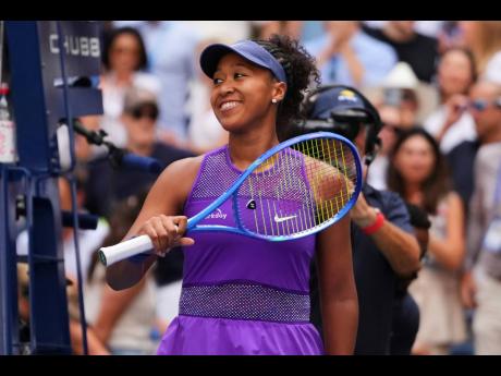 Naomi Osaka, of Japan, celebrates after winning a match against Coco Gauff, of the United States, during the fourth round of the US Open tennis championships, Monday, September 1, 2025, in New York. (AP Photo/Kirsty Wigglesworth)