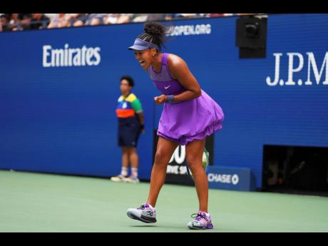 Naomi Osaka of Japan reacts during a match against Coco Gauff of the United States in the fourth round of the US Open tennis championships yesterday.