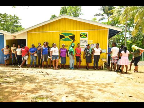 Voters are seeing waiting at a polling station to cast their ballot at Knoxwood Basic School, St Elizabeth.  