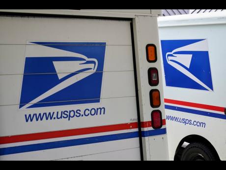 US Postal Service delivery vehicles are parked outside a post office in Boys Town, Neb., August18, 2020. (AP Photo/Nati Harnik, File)