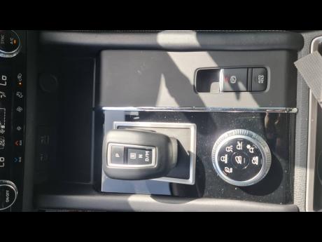 Credit: Kareem LaTouche The clean and ergonomic gear selector sits front and centre, surrounded by key drive mode and parking brake controls.