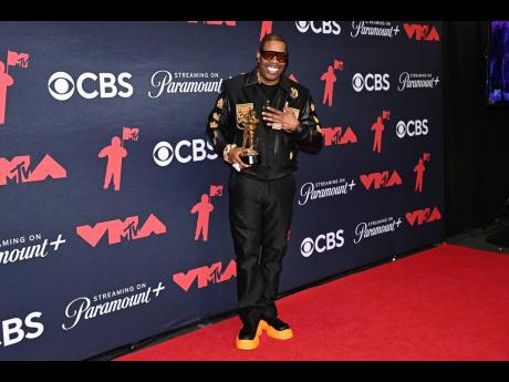 Busta Rhymes, winner of the Rock the Bells Visionary Award, poses in the press room during the MTV Video Music Awards on Sunday.
