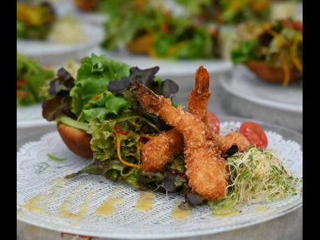 The garden salad with coconut shrimp is served in a fried plantain basket.