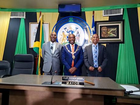 Mayor Andrew Swaby (centre) with Delroy Williams (right) and Dennis Gordon following the acceptance of their resignations as councillors on Tuesday.