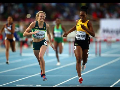 Zeney Van Der Walt of South Africa dips for the finish line ahead of Sanique Walker of Jamaica to win gold in the final of the girls 400m hurdles at IAAF U18 World Championships at the Kasarani Stadium in July 2017 in Nairobi, Kenya.