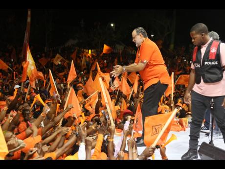 Credit: Nathaniel Stewart Mark Golding, president of the PNP, greeting supporters at the Cental Jamaica mass meeting held on August 24 ahead of the general election.