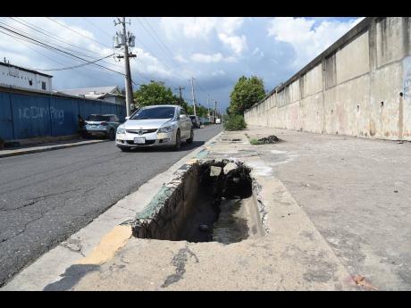 
This open drain along a section of Slipe Pen Road, near the National Blood Bank in Kingston, is a threat to pedestrians.