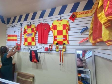 Credit: Albert Ferguson Michelle Sterling, bursar at Cornwall College, inspects the merchandise following the launch of Cornwall College's Memorabilia & More store.