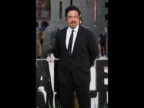 Credit: AP Benicio Del Toro makes a sharp appearance in a black suit.