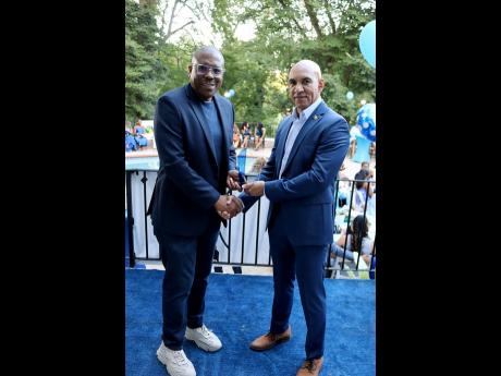 Jamaica’s ambassador to the United States, Major General (Ret’d) Antony Anderson (right), presents 2025 JHUAN’s IMPACT award to Christopher Williams, former CEO of NCB Capital Markets, who was recognised for his role in transforming the Caribbean fin