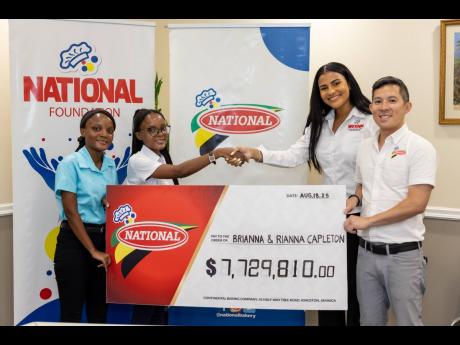 From left: Brianna Capleton and Rianna Capleton accepting a cheque valued at $7,729,810 to cover their medical degrees tuition cost at The University of the West Indies (UWI), Mona from Lauri-Ann Samuels, executive director, National Baking Company Foundat