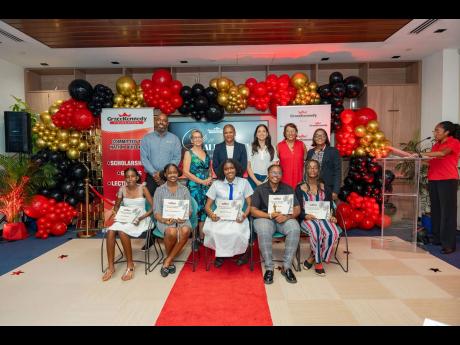 First-time recipients of the 2025 Carlton Alexander Memorial Bursary (seated) at the awards ceremony held on August 29, at GraceKennedy Headquarters. Sharing in the moment are (standing) (from left) Steven Whittingham, CEO, GraceKennedy Financial Group; Pr