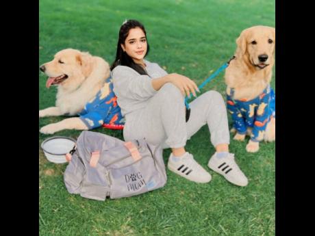 Founder of Wuff Box, Nina Nobbee, enjoys a day at the park with her golden retrievers, Finn (right) and Tuffy, equipped with all their essentials.