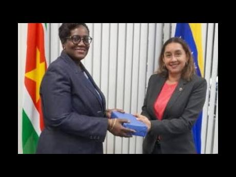 Suriname’s Minister of Finance and Planning Adelien Wijnerman and Venezuelan Ambassador to Suriname, Ayezim Y. Flores Rivas.