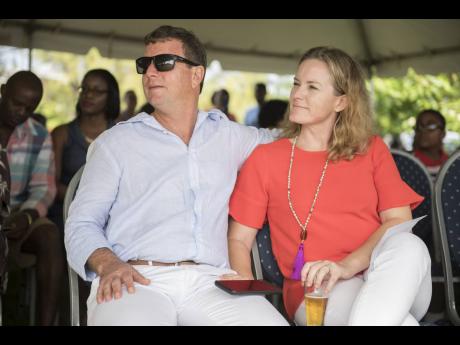 Credit: File Jason Henzell (left) and his wife, Laura.