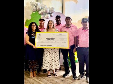  The Miami-based Paquee Golf Club has raised J$10.5 million for Mustard Seed Communities in Jamaica towards the caring of the disabled and abandoned children and adults. From left are representatives of Mustard Seed Communities and members of the Paquee Go