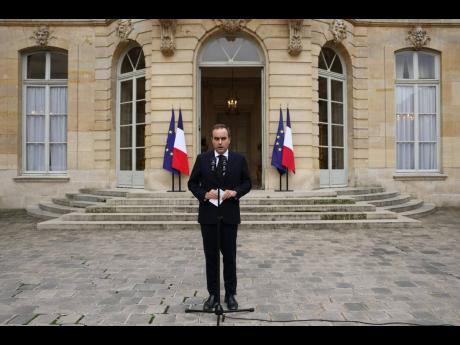French outgoing Prime Minister Sebastien Lecornu, who resigned just a day after naming his government, delivers his statement at the Hotel Matignon in Paris, Monday, October 6, 2025. (Stephane Mahe/Pool via AP)