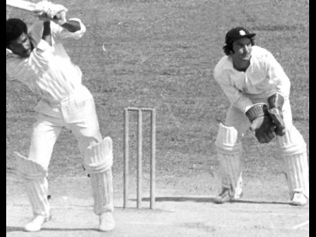 This February 21, 1974 file photo shows Bernard Julien, West Indies all-rounder who bats right-handed and bowls left-handed, playing a shot through the leg side at Sabina Park in the second Test against England. Julien, who set the stage for quick runs, sl