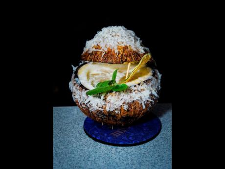 Shannamar Smith, from Ultimate Dining & Nightclub in Mandeville, created this nightlife piña colada remix: coconut-washed Appleton Reserve, guava, coconut syrup and lime, shaken into a chilled coconut shell.