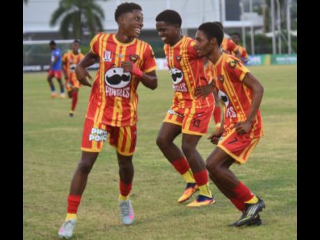 Ashley Anguin/Photographer 
Cornwall College players celebrate scoring a goal during an ISSA daCosta Cup game against Kemps Hill at the Montego Bay Sports Complex yesterday.