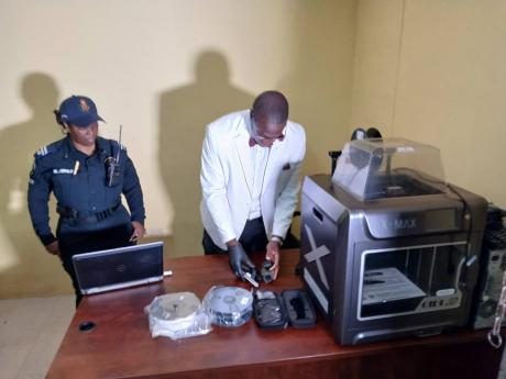 A 3D printer seized by police during coordinated operations across St Catherine on October 11, 2025. Investigators believe the device was being used to manufacture firearm components, including suppressors. 