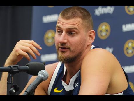 Credit: AP Denver Nuggets centre Nikola Jokic responds to questions during an NBA basketball media day news conference on Monday, September 29 in Denver.