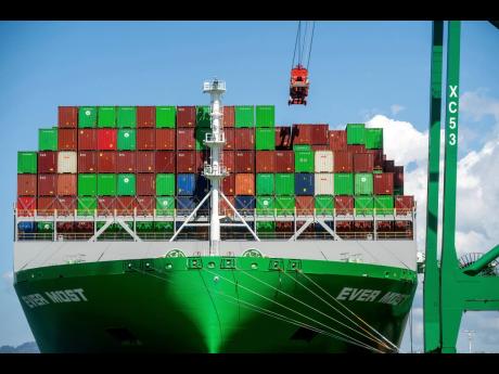 Shipping containers line the ‘Ever Most’ cargo vessel docked at the Port of Oakland on April 3, 2025, in Oakland, California.

