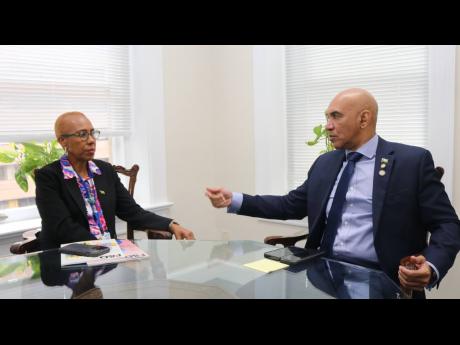 Jamaica’s Ambassador to the United States Major General (ret’d) Antony Anderson right engages Minister of Finance and the Public Service Fayval Williams in discussion during  a courtesy call on ambassador Anderson on Monday. 