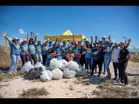 Some of the team members from Jamaica Broilers Group and its Best Dressed Chicken and Hi-Pro divisions, alongside NEPA’s Leonard Francis (second right), chief executive officer, and Monique Curtis (right), manager of Ecosystems Management Branch, after t