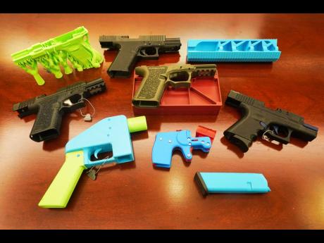 Credit: Richard Drew Ghost guns, provided by the New York City Police Department, are displayed in the Manhattan District Attorney's office, in New York, Wednesday, October 15, 2025. (AP Photo/Richard Drew)