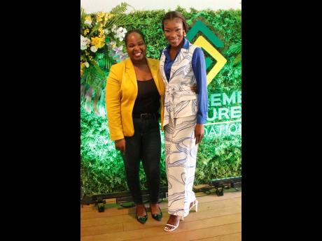 Tishauna Mullings (right) is joined by Chloleen Daley-Muschett, assistant vice-president of public relations and corporate affairs, for a quick photo during the Supreme Ventures Foundation Supreme Community Hero Programme finale.