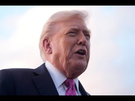 President Donald Trump speaks to reporters after arriving on Air Force One, Friday, October17, 2025, at Palm Beach International Airport in West Palm Beach, Florida. (AP Photo/Mark Schiefelbein)