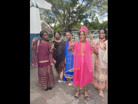 Harrison’s Preparatory students dressed in traditional attire pose for a photo during Heritage Week celebrations.