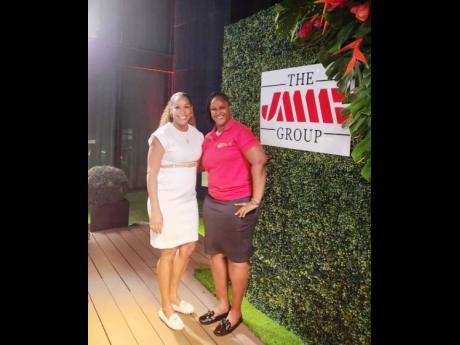 Shani Duncan-Falconer (left), senior corporate manager at JMMB Group SME Resource Centre, with Primrose Oliver of Called Out Gospel Radio, during the PowHerful Women in Business Meet & Greet at AC Hotel, Kingston. 