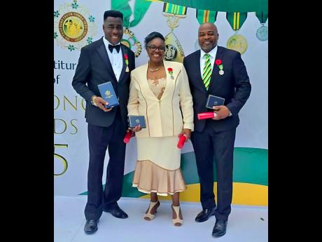 From left: Sylvanus Thompson, Vivienne Nelson-Campbell and Chris Campbell pose with their awards on Monday.
