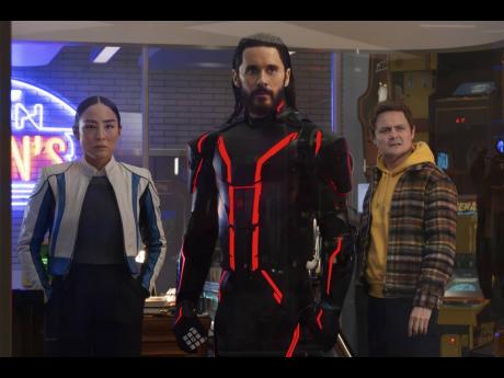 This image released by Disney shows (from left) Greta Lee, Jared Leto and Arturo Castro in a scene from ‘Tron: Ares’. 