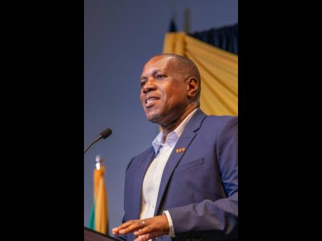 Paul Elliott, CEO, VM Building Society, delivers remarks at a diaspora forum in Florida in April. 