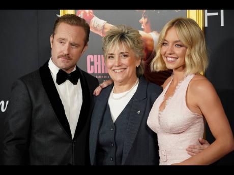 Boxing legend Christy Martin is flanked by the co-stars of the ‘Christy’ biopic, Ben Foster and Sydney Sweeney (right). 