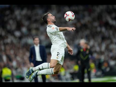 Real Madrid’s Dani Carvajal receives the ball during the La Liga football match between Real Madrid and Villareal in Madrid, Spain, on October 5, 2024. 