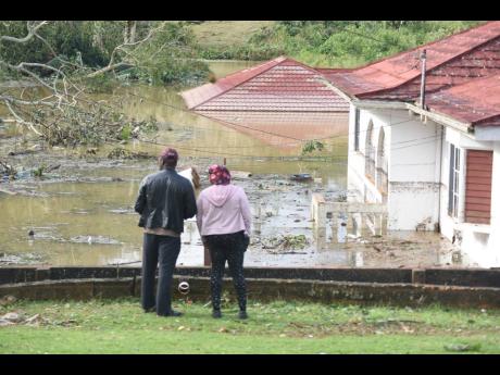 Three houses and several vehicles were submerged along Gibson Close, off Ward Avenue in Mandeville, following Hurricane Melissa on Wednesday.