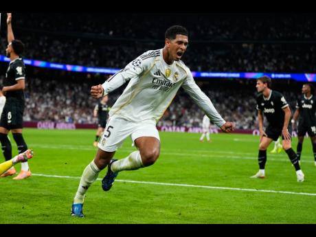 Real Madrid’s Jude Bellingham celebrates after scoring his side’s first goal during the Champions League opening phase match against Juventus in Madrid, Spain, on October 22.