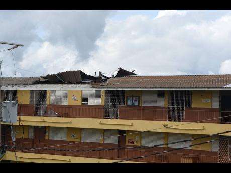 Roof damage at Manchester High School, which occurred during the passage of Hurricane Melissa.